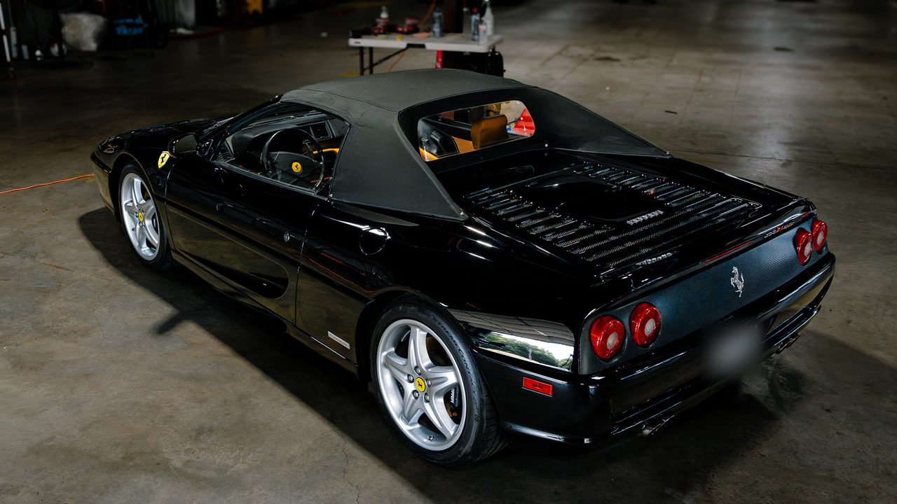Black Ferrari 355 Spider in the Slick Auto Care shop in Little Rock AR after paint correction